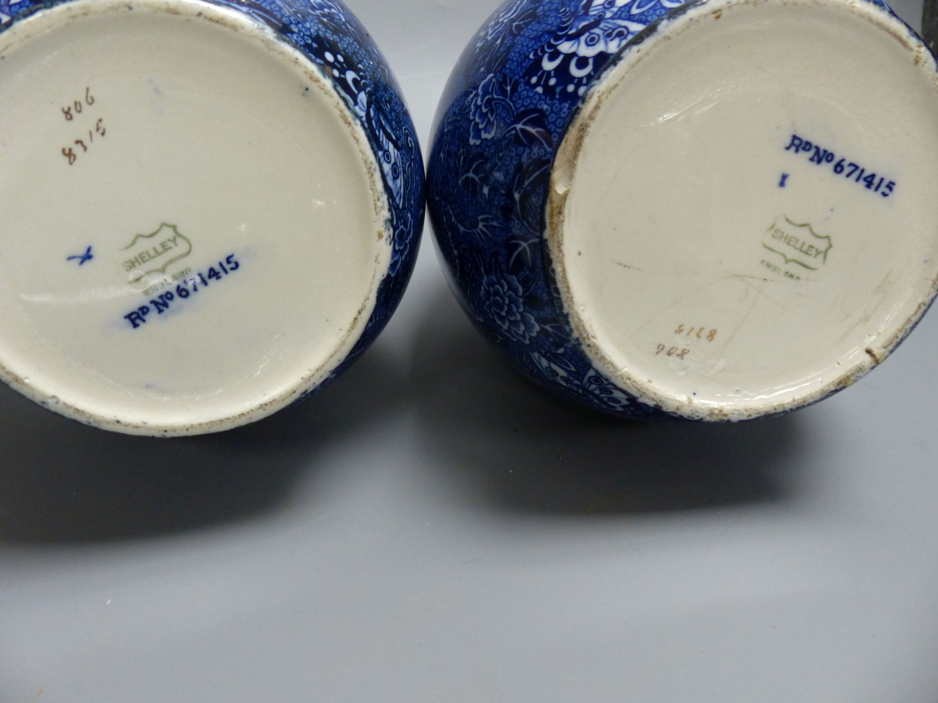 A pair of early 20th century Shelley blue printed pottery ovoid vases, height 23.5cm